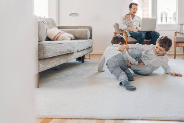 istock Father trying to work from home 1214199704