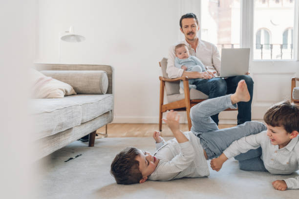 istock Father trying to work from home 1214199735