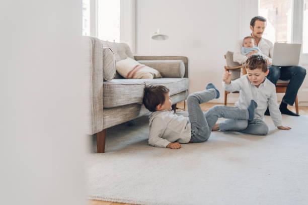 istock Father trying to work from home 1214199740