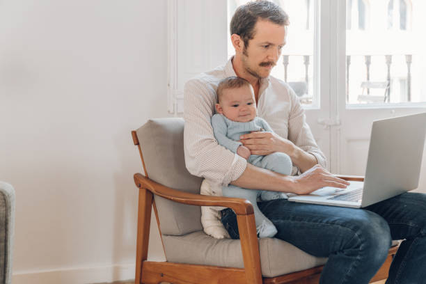 istock Father trying to work from home 1214199750