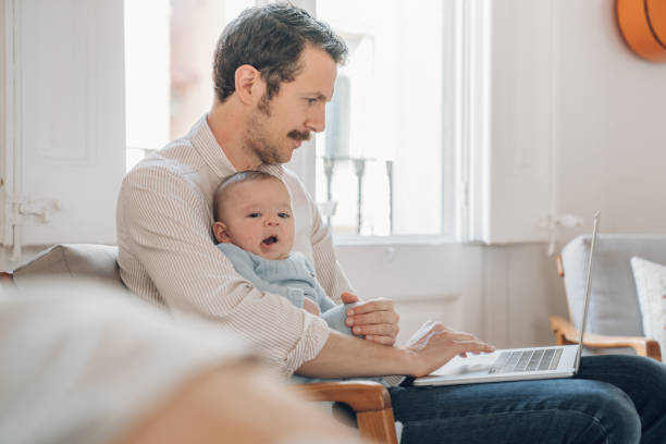 istock Father trying to work from home 1214199797
