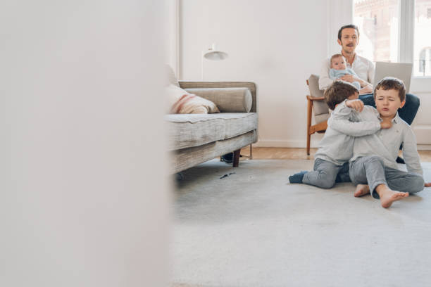 istock Father trying to work from home 1214199799
