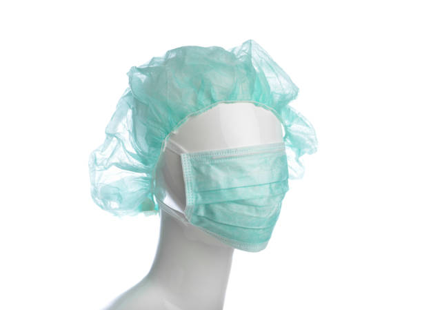 Young asian man wearing face mask against white background.