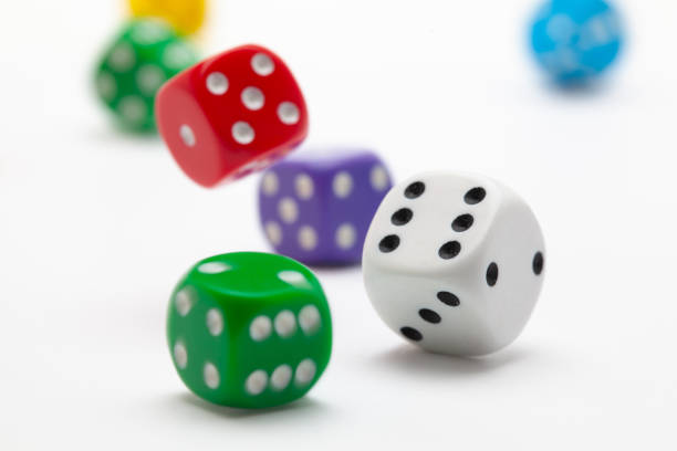 istock Playing dice at white wooden background. 1214202557
