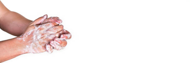 istock Young man washing hands with soap, wide banner space for text right side, isolated on white. Can be used during coronavirus covid19 outbreak prevention 1214202571