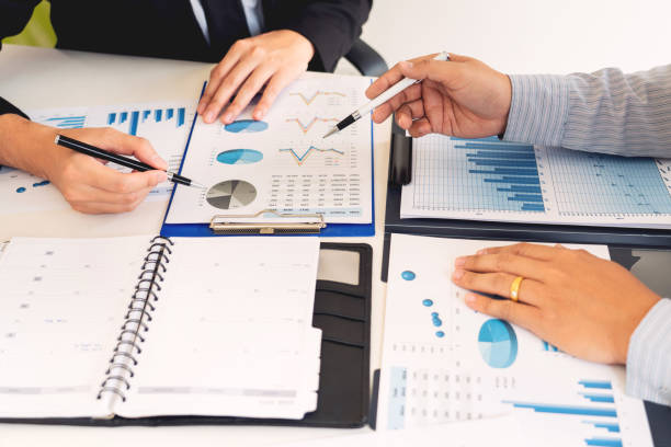 istock Business Corporate team brainstorming, Planning Strategy having a discussion Analysis investment researching with chart at office his desk documents and saving concept. 1214205408