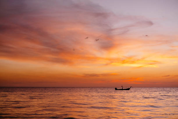 istock Boat at a beautiful sunset in Phuket, Thailand 1214206684