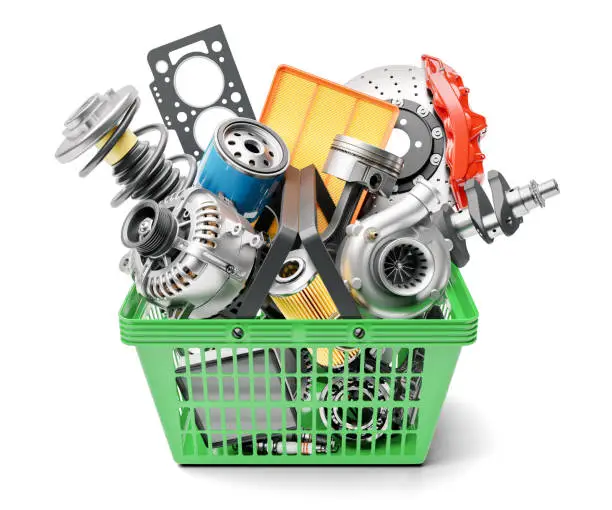 Photo of Car spares parts in market basket isolated on white background