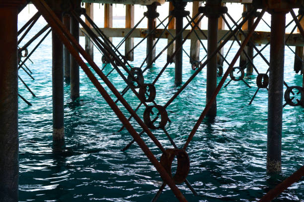 Under an Old Pier with Blue Clear Water stock photo