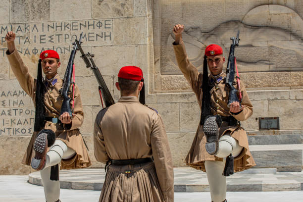 evzonis, the presidential honor guards. changing guards. athens, greece - tourist photographing armed forces military imagens e fotografias de stock