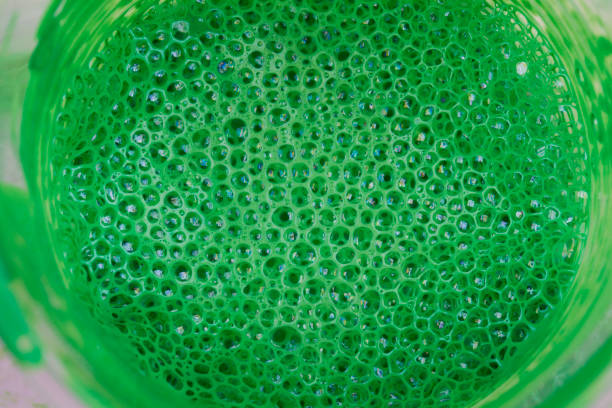 istock green bubbles in glass with paint. 1214211693