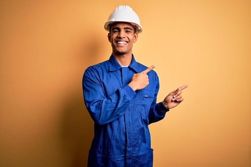 portrait of a handsome worker in a hard hat