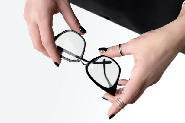 istock Beautiful womans hand with elegant manicure. Minimal black nail design. 1214212783