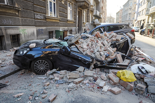 Zagreb, Croatia - March 22, 2020 : In the morning capital of Croatia, Zagreb has been hit by the magnitude of the earthquake 5.5 per Richter. Cars have been destroyed by fallen parts of the building.