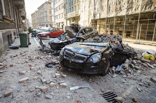 Zagreb, Croatia - March 22, 2020 : In the morning capital of Croatia, Zagreb has been hit by the magnitude of the earthquake 5.5 per Richter. Cars have been destroyed by fallen parts of the building.