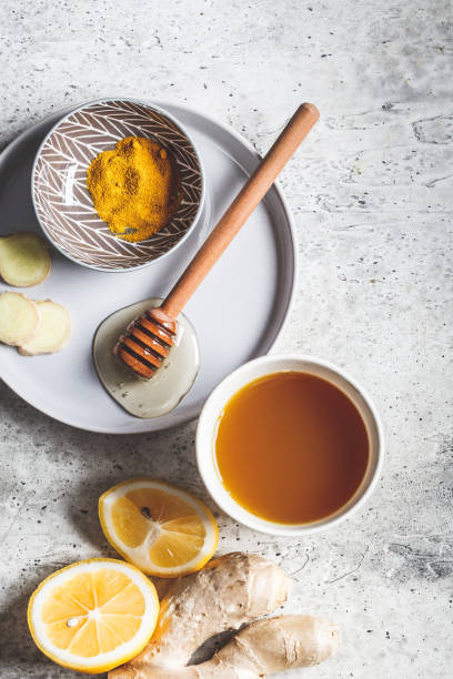 beverage for raising immunity concept.
warm drink with turmeric, ginger, honey and lemon. - ginger tea cup cold and flu tea imagens e fotografias de stock