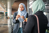 Asian muslim corporate women going to work
