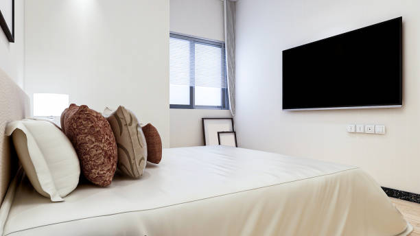 istock 3D rendering, elegant and modern bedroom design, big bed with overcoat cabinet, coffee table, TV, carpet, etc., very comfortable and leisure. 1214214589