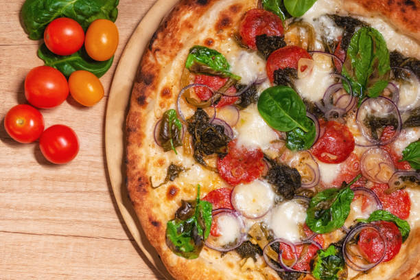 istock Delicious baked pizza and vegetables 1214217644