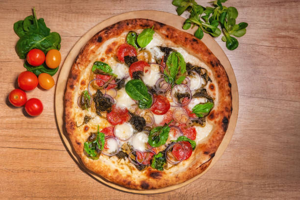 istock Delicious baked pizza and vegetables 1214217778