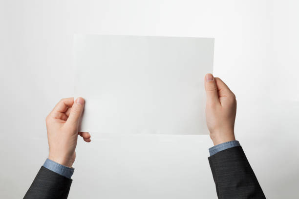 istock Empty A4 paper brochure in hands. White sheet for design 1214217847
