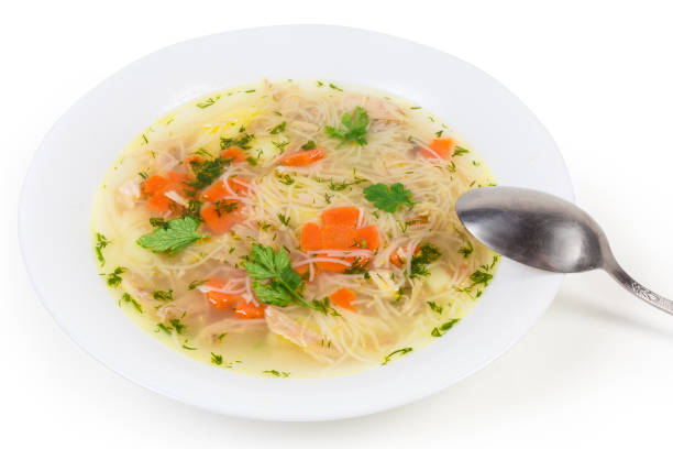 istock Chicken soup with thin short vermicelli in dish with spoon 1214219388