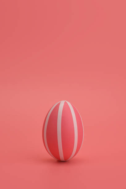 istock Monochrome Easter. Pink striped egg on a pink background. Copy space. 1214220198