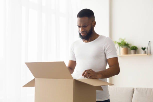 istock Sad african american millennial guy received wrong order 1214220268
