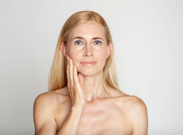 istock Middle-aged woman with perfect skin looking at camera 1214220532