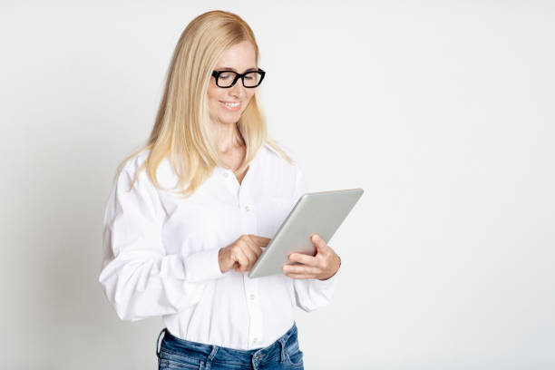 istock Mature Businesswoman Using Tablet In Modern Studio 1214220673