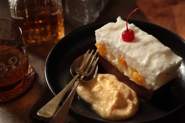 istock Fruit Cocktail, Egg White and Chocolate Pudding with Vanilla Custard Sauce on Black Ceramic Plate 1214220765