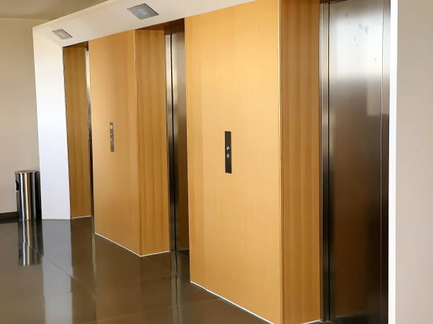 istock Modern steel elevator cabins in a business lobby or Hotel 1214220878