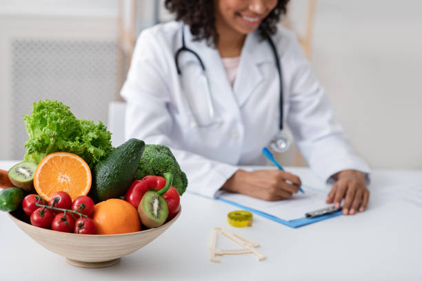 istock African doctor dietologist taking notes in her office 1214221052