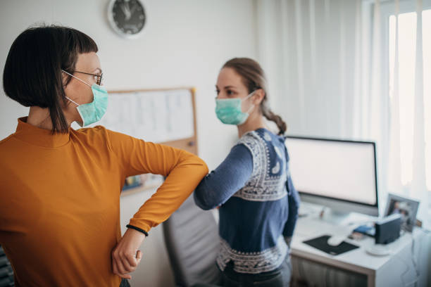 istock New kind of greeting with elbows do to coronavirus outbreak 1214222390