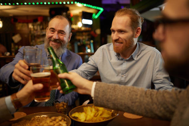 istock Mature men toasting with beer 1214223586