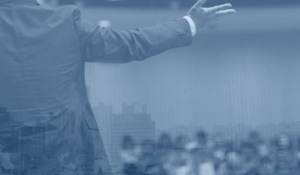 istock Business presentation given by executive. Corporate seminar with expert speaker presenting to people. Man giving speech during lecture. Leadership training coach in tech workshop. Meeting concept. 1214224388