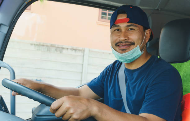 istock Truck driver wearing a mask 1214224879