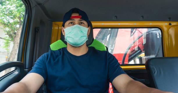istock Truck driver wearing a mask 1214224881