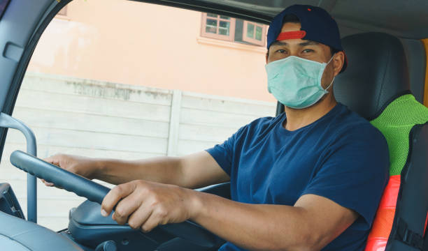 istock Truck driver wearing a mask 1214224886