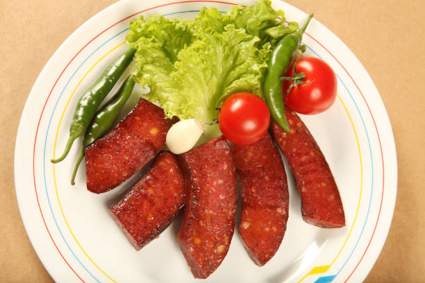 istock fried sausage and fresh vegetables 1214226543