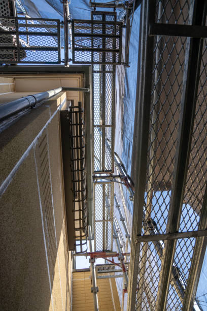 istock Exterior wall painting work.Scaffolding, Renovate housing construction. 1214227490