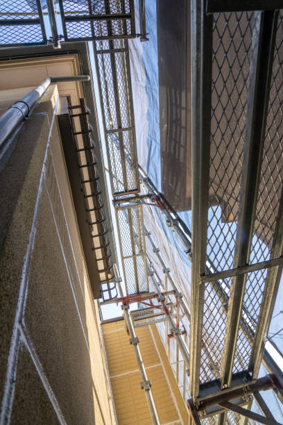 istock Exterior wall painting work.Scaffolding, Renovate housing construction. 1214227619