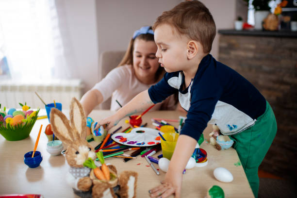 istock Children painting Easter eggs stock photo 1214228029