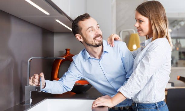 istock Couple engaged in household chores 1214228679
