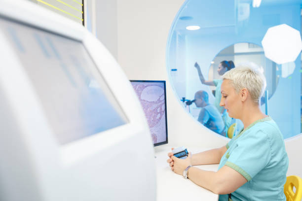 istock Medical research at the lab. Scientist in laboratory working with medical samples  using modern equipment. Laboratory Medical Equipment Medical devices for analyzes. Blood tested for Coronavirus (COVID-19),  Cancer. definition of DNA, virus, 1214230303