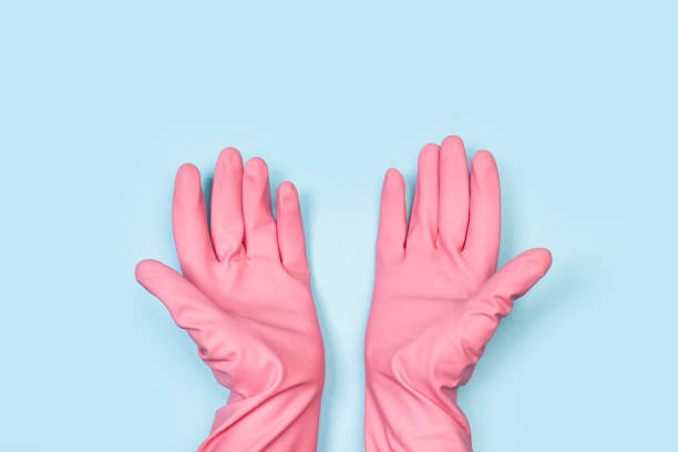 istock Hands with pink rubber gloves 1214230469
