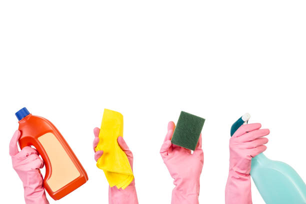 istock Hands holding cleaning products 1214230528