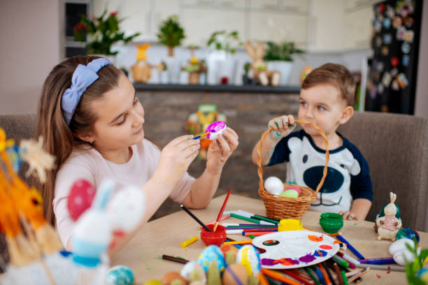 istock Children painting Easter eggs stock photo 1214235488