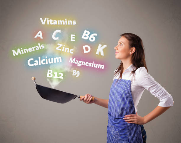 istock Young woman cooking vitamins and minerals 1214242905