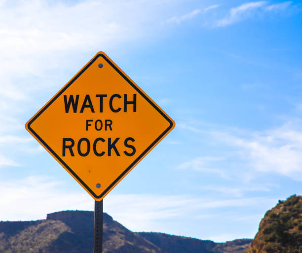 istock Watch for rocks, road sign 1214243101